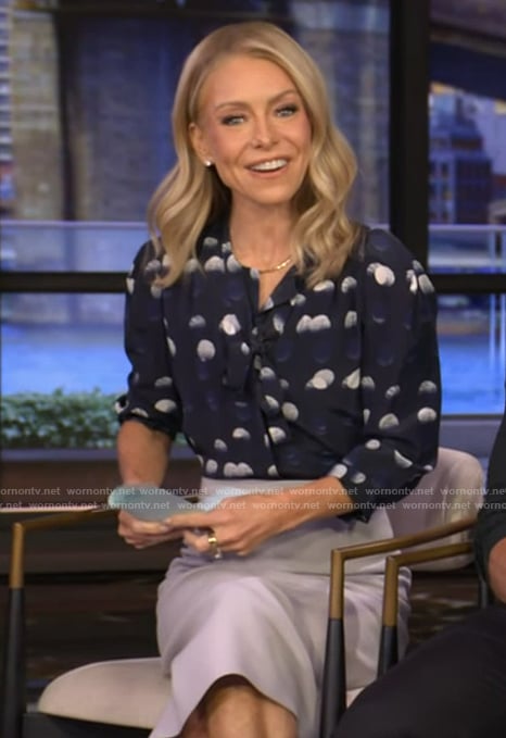 Kelly’s navy dotted tie neck blouse on Live with Kelly and Mark