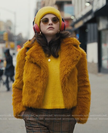 Mabel’s plaid pants and mustard fur jacket on Only Murders in the Building