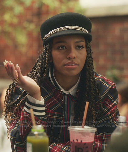 Monet’s tartan bomber jacket and black cap on Gossip Girl