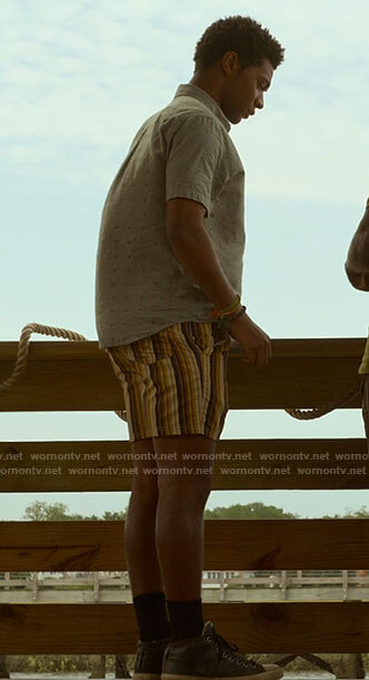 Pope’s s grey printed shirt and striped shorts on Outer Banks