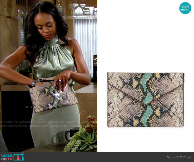 Rebecca Minkoff Snake Leo Clutch worn by Amanda Sinclair (Mishael Morgan) on The Young and the Restless