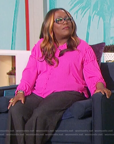 Sheryl’s pink ruffle trim blouse on The Talk