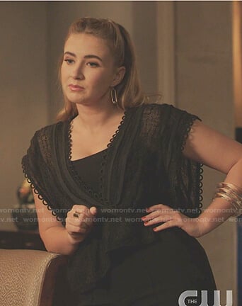 Amanda’s black scalloped trim wrap top on Dynasty