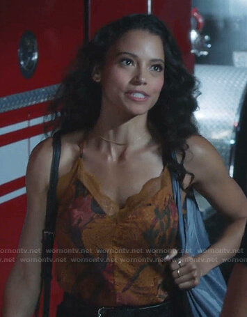 Ana Flores’s orange floral lace trim cami on 9-1-1