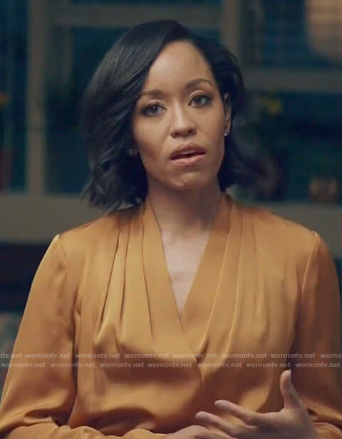 Charley’s orange pleated v-neck blouse on Queen Sugar