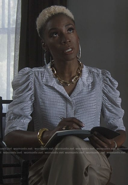 The Chemist’s white snake print puff sleeve top on American Horror Story