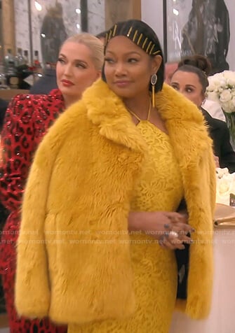 Garcelle’s yellow floral lace dress and fur coat on The Real Housewives of Beverly Hills