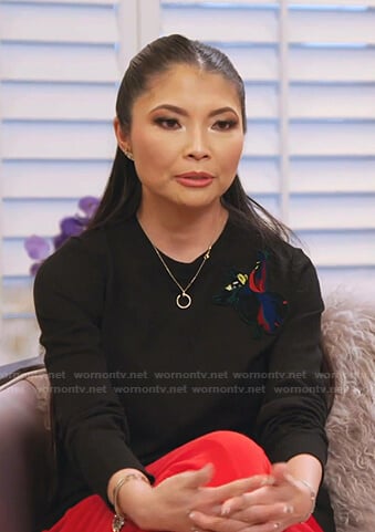 Jennie’s black embroidered patch sweater on The Real Housewives of Salt Lake City