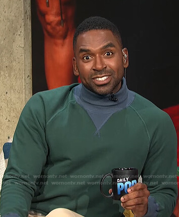 Justin’s green colorblock turtleneck sweatshirt on E! News Daily Pop