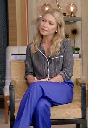 Kelly’s black striped shirt and blue pants on Live with Kelly and Ryan