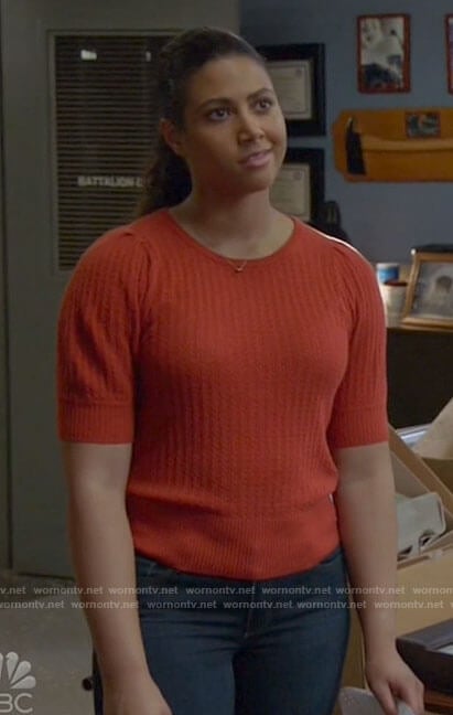 Kylie’s orange knit top on Chicago Fire