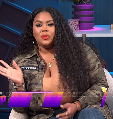 Nina’s camo jacket with patches on E! News Nightly Pop