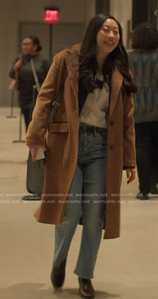 Nora’s camel coat on Awkwafina is Nora From Queens