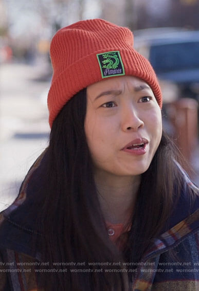 Nora’s orange dragon icon beanie on Awkwafina is Nora From Queens