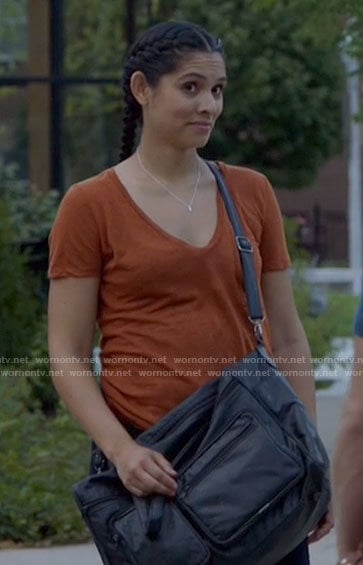 Stella’s orange v-neck tee on Chicago Fire
