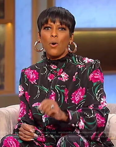 Tamron’s black floral blouse and pants on Tamron Hall Show