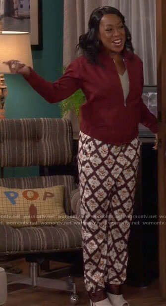 Tina’s burgundy printed pants on The Neighborhood