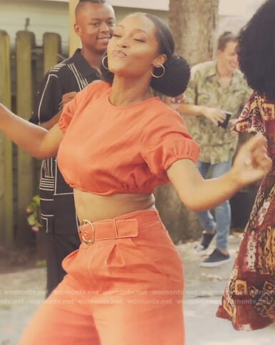 Angela’s orange crop top and pants on Our Kind of People