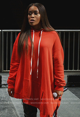 Brianna’s red oversized hoodie on Queens