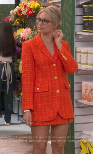 Gemma’s orange tweed blazer and skirt set on The Neighborhood
