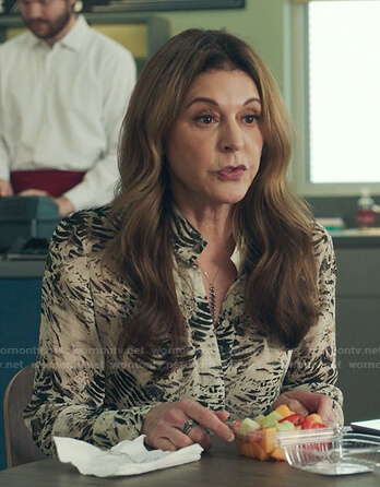 Kit’s white abstract print blouse on The Resident