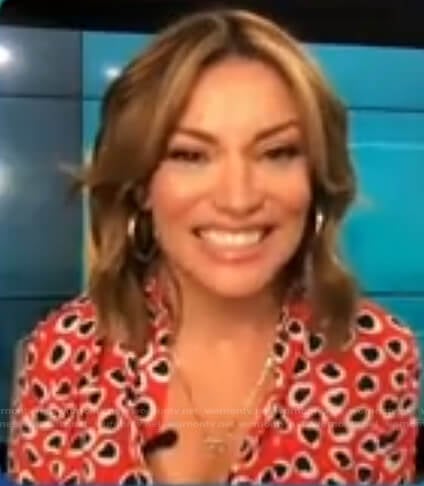 Kit’s red heart print button down shirt on Access Hollywood