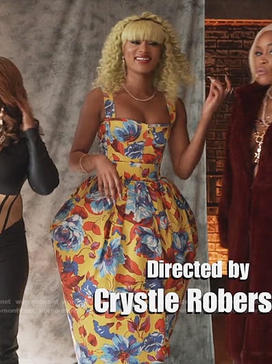 Lauren’s yellow floral print top and skirt on Queens
