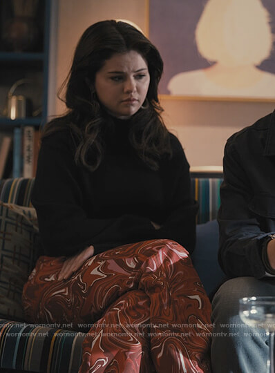 Mabel’s red marble printed pants on Only Murders in the Building