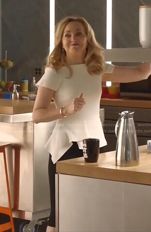 Marissa’s white peplum top and skirt on Bull