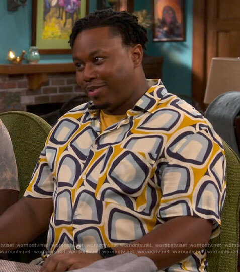Marty’s yellow abstract print shirt on The Neighborhood