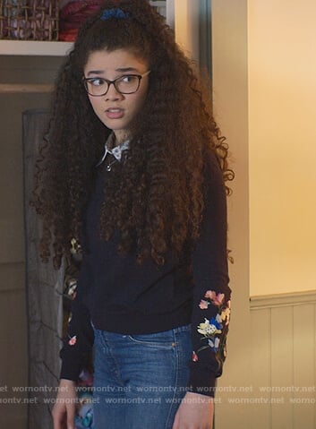 Mary-Anne’s navy floral embroidered sweater on The Baby-Sitters Club