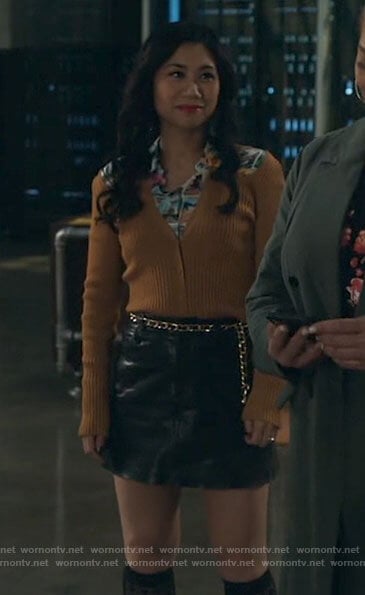 Mel’s postcard print shirt and cardigan with cutout shoulders on The Equalizer