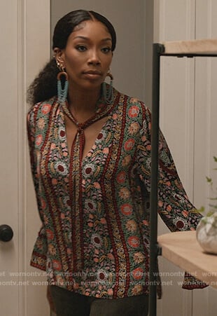 Naomi’s green floral print tie neck blouse on Queens