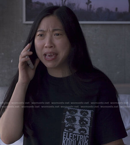 Nora’s black Electric Koolaid t-shirt on Awkwafina is Nora From Queens