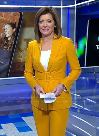 Norah’s yellow belted suit on CBS Evening News