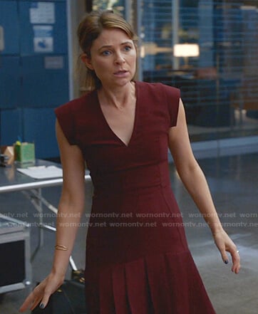 Taylor’s burgundy pleated v-neck dress on Bull