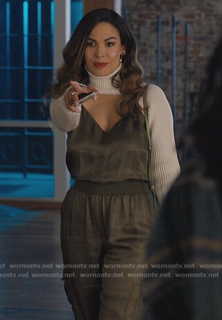Valeria’s green silk jumpsuit on Queens