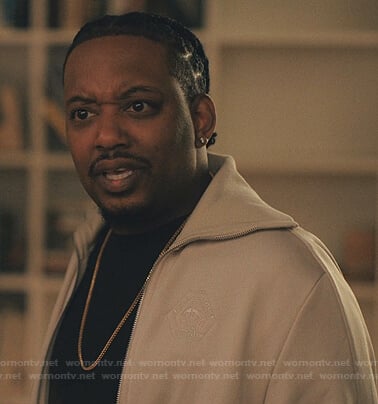 Yogi’s white track jacket on Love Life