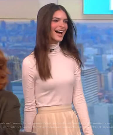 Emily Ratajkowski’s white turtleneck top and skirt on The View