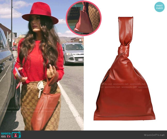 Bottega Veneta The Twist Butter Napa Wristlet Clutch Bag worn by Lisa Barlow on The Real Housewives of Salt Lake City