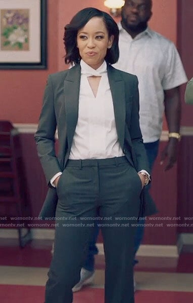 Charley’s white keyhole blouse and grey suit on Queen Sugar