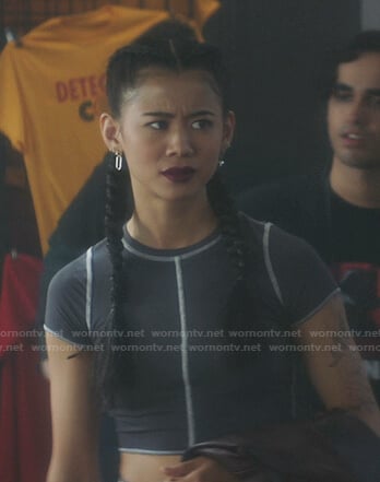 George’s grey cropped tee with white stitching on Nancy Drew