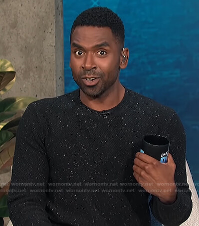Justin’s black speckled textured sweater on E! News Daily Pop