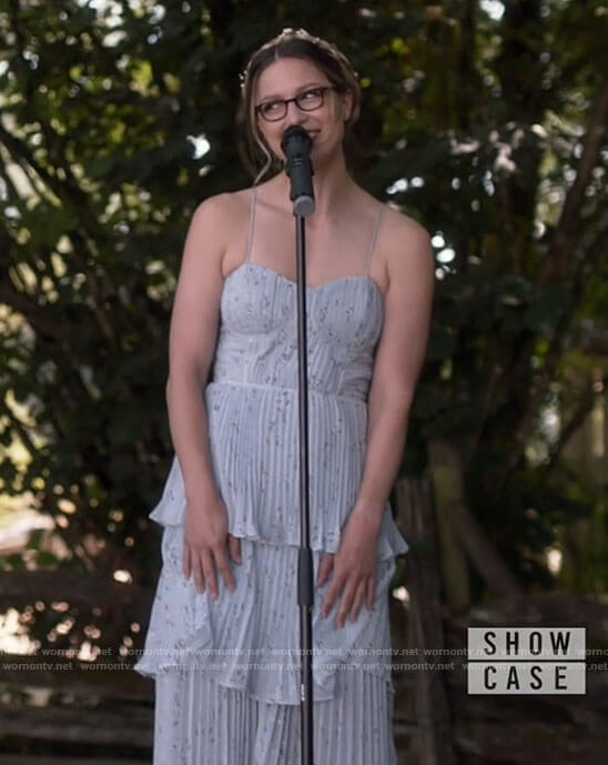 Kara’s blue floral pleated dress on Supergirl
