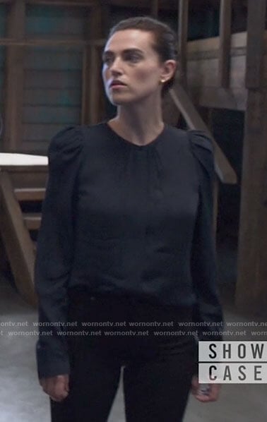 Lena’s navy puff sleeve blouse on Supergirl