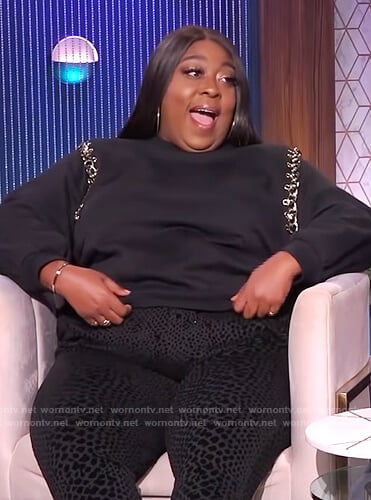 Loni’s black chain embellished sweater on The Real