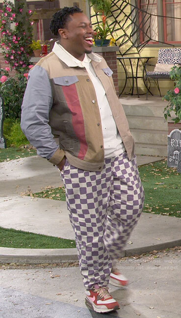 Marty’s colorblock shirt and purple checkered pants on The Neighborhood