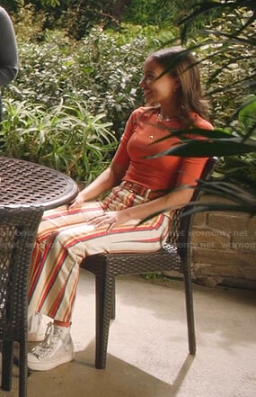 May’s orange top and striped flare pants on 9-1-1