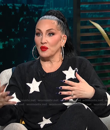 Michelle Visage’s black star print sweater and pants on E! News Daily Pop