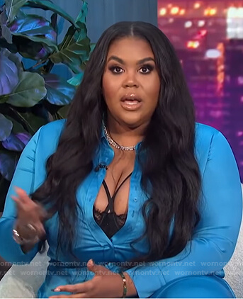 Nina’s blue satin shirt and pants on E! News Nightly Pop
